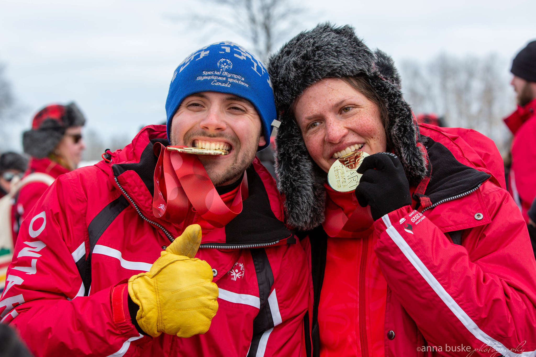 Two gold medal-winning athletes posing for the camera